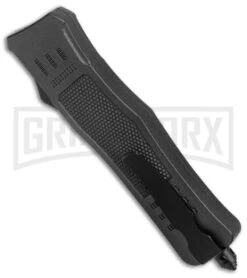 Atomic Defender Medium OTF Auto Drop Point Knife Black Serrated Satin 9 Atomic Defender Medium OTF Auto Drop Point Knife Black Serrated Satin -Grindworx Atomic Defender Medium OTF Auto Black Satin DP Serr GX 37507 jr side large